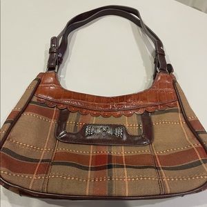 MC Bag  - rust & brown with silver heart hardware.  Has a “Brighton” look…